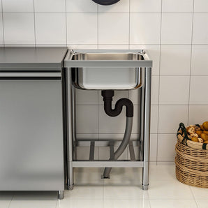 Stainless steel sink unit with shelf frame and U-shaped drainpipe underneath.