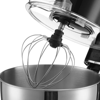 Wire whisk attachment with mixer head over stainless bowl
