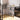 Single-compartment stainless sink with faucet on tall open-frame shelving stand