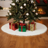 White plush Christmas tree skirt with oval fuzzy pile and gift boxes on top