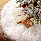 White plush oval tree skirt with red and gold wrapped gift boxes