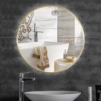 Round bathroom wall mirror with gold metal frame and clear reflective glass