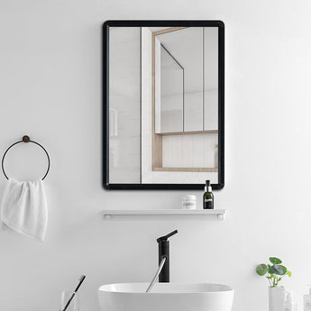 Black-framed rectangular adhesive mirror, clear glass surface