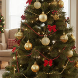 Gold-tone Christmas ball ornaments hanging on a decorated tree