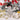 Glitter star tree topper with assorted white, silver, and gold Christmas ornaments