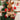 Plush reindeer Christmas ornament with plaid scarf and red nose