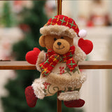 Plush bear Christmas ornament with plaid scarf and red heart accents