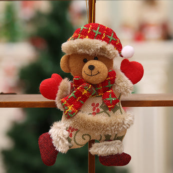 Plush bear Christmas ornament with plaid scarf and red heart accents