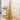 Collapsible pop-up tinsel Christmas tree, gold, with base and sparkling star tinsel