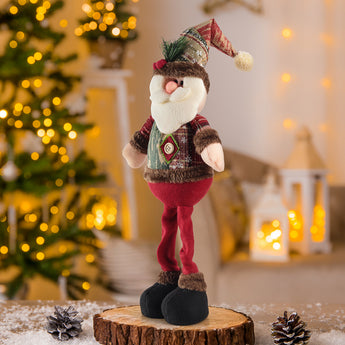 Standing Santa Claus plush doll wearing red pants and brown boots, green vest with round button