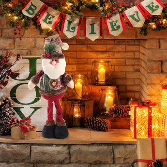 Standing Santa Claus plush doll in green vest with button, red trousers, black boots and white beard