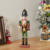 Christmas nutcracker soldier figurine with white beard, black hat, green pants, holding a sword