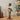 Christmas nutcracker soldier figurine with white beard, tall black hat, red and green uniform