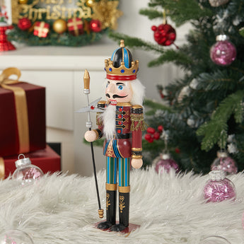 Wooden nutcracker soldier ornament with painted crown, holding staff, red and blue coat