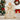 Cream angel tree topper in gold-patterned dress with white feather wings