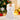 Angel tree topper with white gown, feather wings, and gold trim