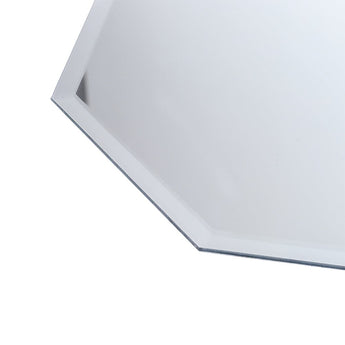 Close-up of octagonal mirror beveled edge and smooth white frame