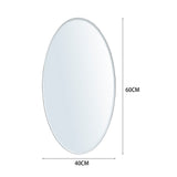 Oval frameless wall mirror size: 60cm height, 40cm width