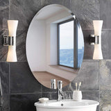 Oval frameless wall mirror with slim silver edge border and reflective surface