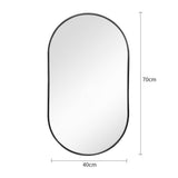 Black oval wall mirror with rounded top and bottom frame, smooth reflective glass.