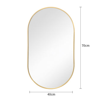 Gold oval wall mirror with rounded top and bottom, thin metal frame and reflective glass.