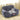 Cozy dog car seat bed in dark gray plush with raised bolsters and logo patch