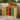 Wood trash bin storage shed with open roof lid, side doors, and vent slats