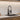 Black kitchen faucet with pull-down sprayer, mounted on countertop sink