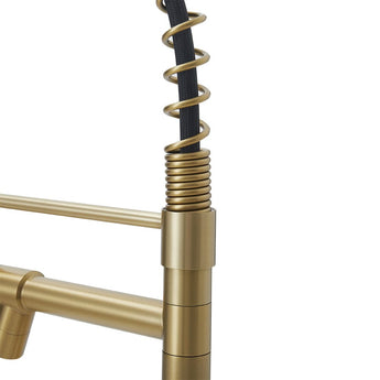 Stainless steel kitchen faucet in brushed gold, spring pull-down head detail