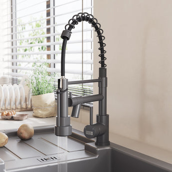 Black kitchen faucet with pull-down sprayer, water flowing from spout