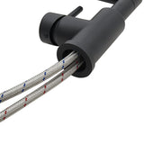 Braided hose detail with black faucet nozzle collar