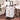 White cosmetic trolley case, closed with rose-gold locks, side handle, and rolling wheels