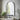Decorative arched wall mirror with black metal frame and flat base