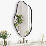 Irregular wall mirror with dark metal frame, tall rounded oval shape