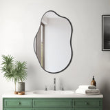 Irregular wall mirror with dark metal frame, rounded shield shape