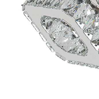 Close-up of clear faceted crystal prisms on a square chrome ceiling light canopy