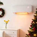 White PTC electric heater on wall with digital display and glowing heat outlet