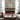 Wall-mounted electric fireplace with red flame effect and dark glass opening