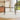 Rectangular tempered glass dining table with black legs and clear tabletop
