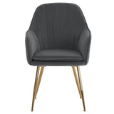 Dark gray velvet dining chair with ribbed back, padded seat, and gold metal legs