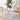 White rectangular dining table with smooth top and solid apron