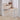 White 4-panel wooden pet gate, corner configuration with vertical slats