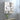 Rectangular wall mirror cabinet, doors open, interior shelves for toiletries and towels