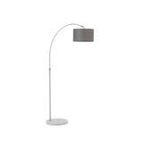 Tall arched standing lamp with grey drum shade and marble-look base