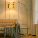 Arched floor lamp with gold fabric shade and marble-look base, 131–186 cm