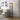Black floor lamp with 3 wood shelves and arched glass motif panels