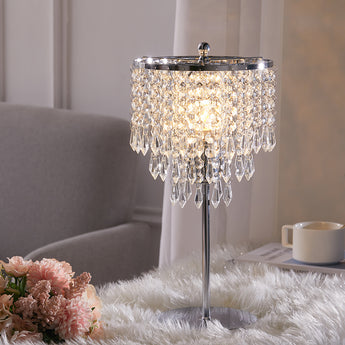 Small crystal table lamp with bright crystal drum shade and polished metal stand