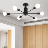 Black 6-bulb ceiling light with angled metal arms and white glass globe shades