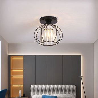 Lantern pendant in room: black canopy and clear glass cage light