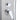 Chrome control knob and handheld shower outlet on a silver shower panel